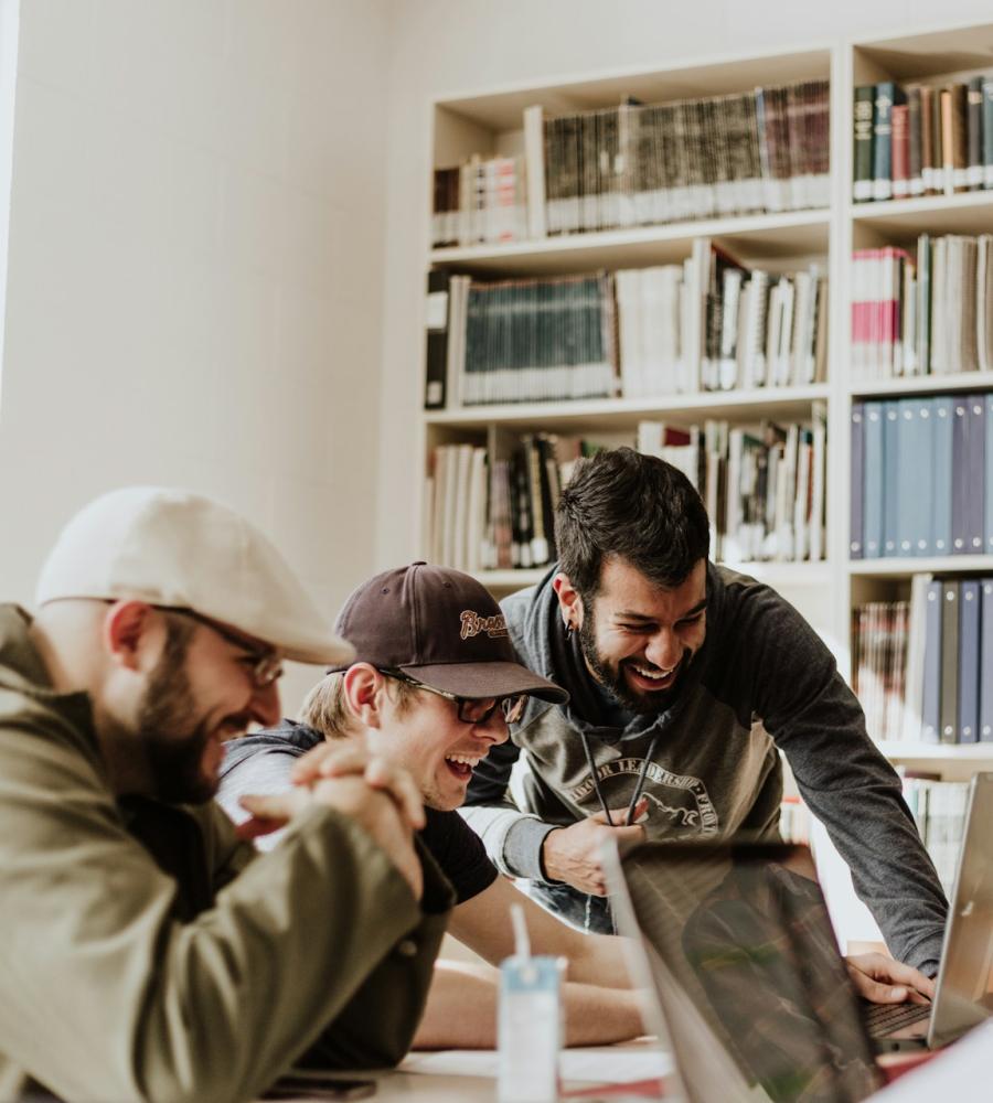 people gathered around a computer